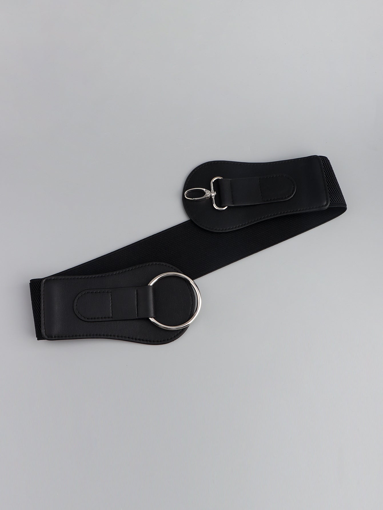 Black elastic cincher belt with silver ring and buckle detail
