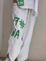 White graphic tee and drawstring pants set with green lettering