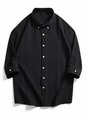 Black oversized cotton pinstripe button-down shirt with a button collar.