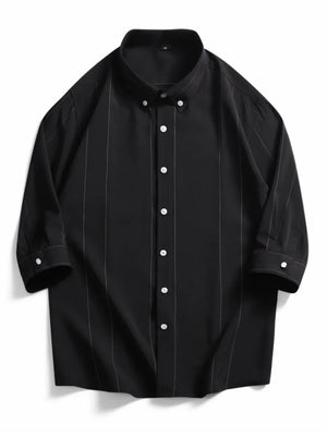 Black oversized cotton pinstripe button-down shirt with a button collar.