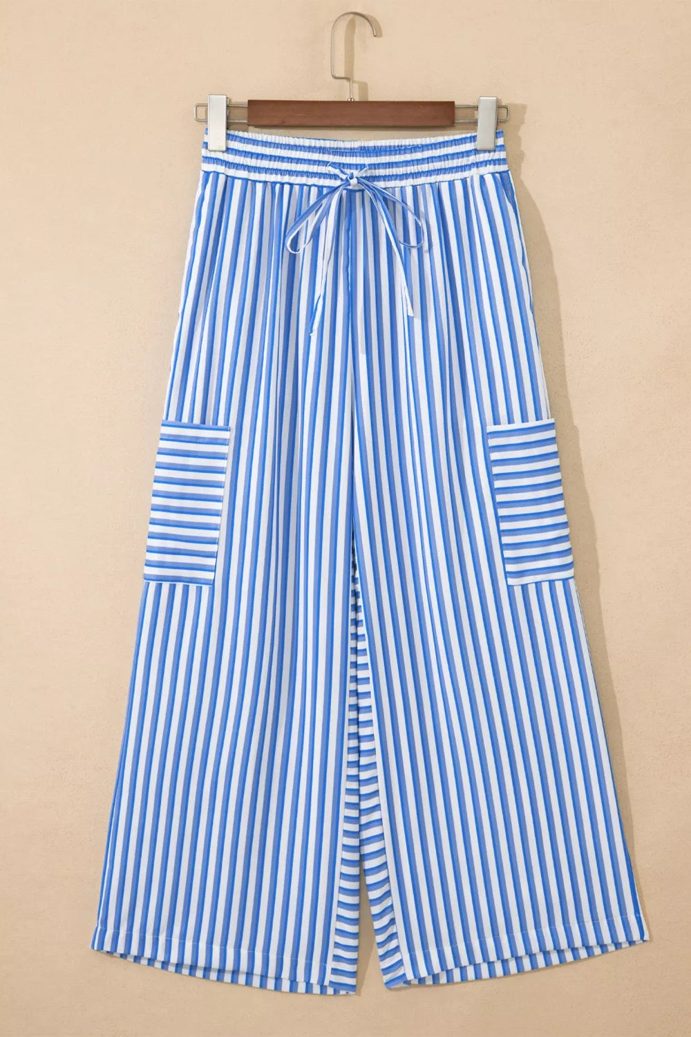 Maternity wide-leg ankle pants with blue and white stripes, drawstring waist, and patch pockets.