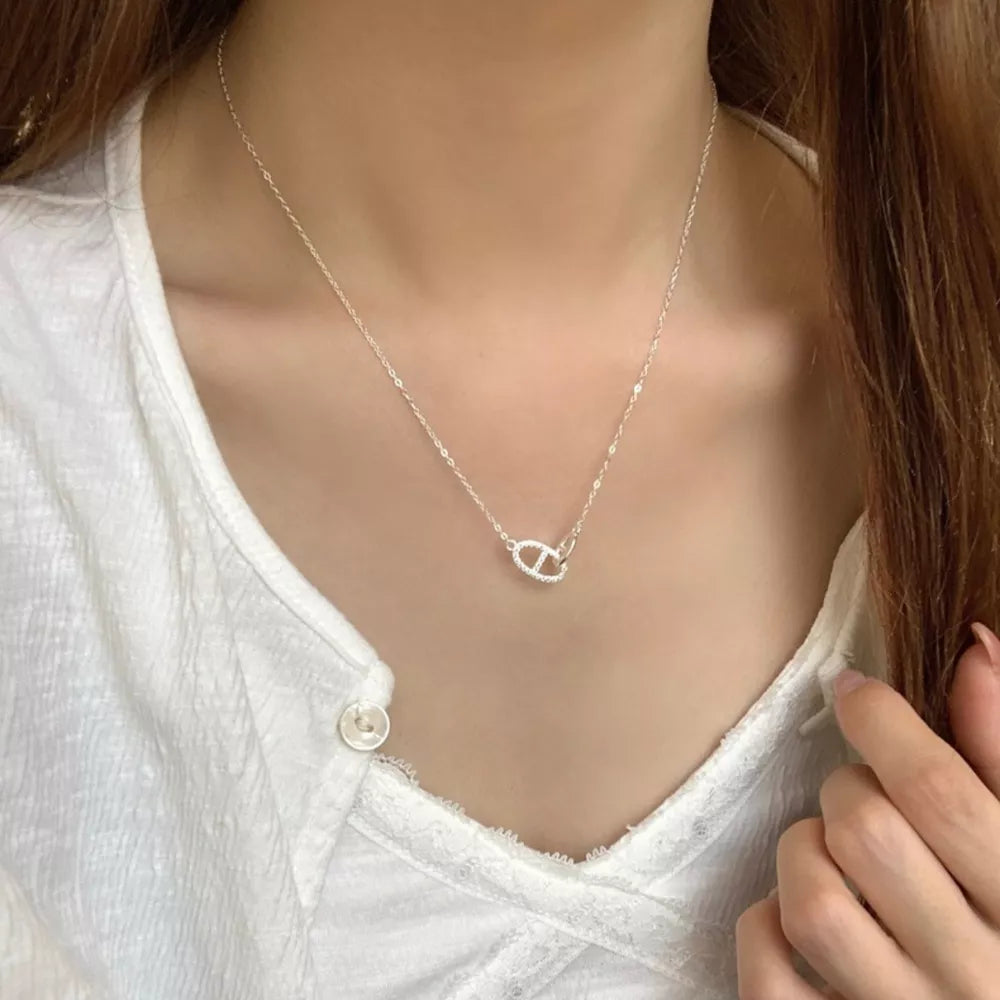 Geometric zircon adorned silver necklace with delicate chain