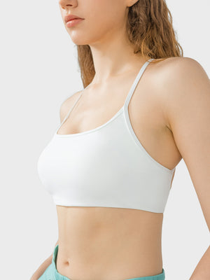 White active crop top with thin spaghetti straps and a square neckline.