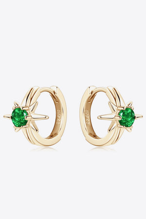 Gold starburst hoop earrings with emerald green gems