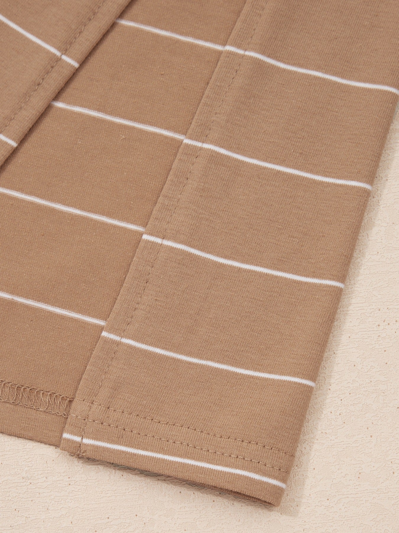 Brown striped maxi t-shirt dress with a casual, basic style.