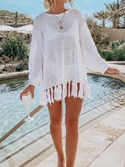 White open-knit acrylic beach cover-up with fringe hem, long sleeves and crew neck.