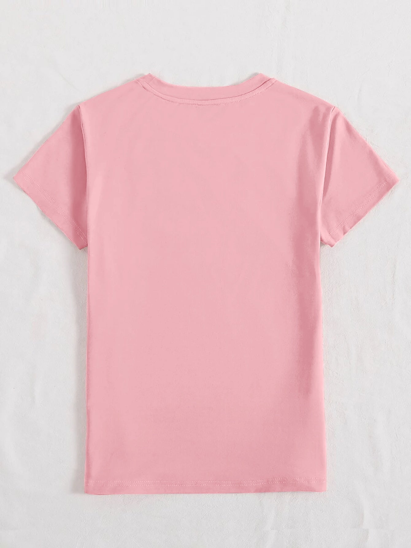 Blush pink graphic tee with crew neck and short sleeves.
