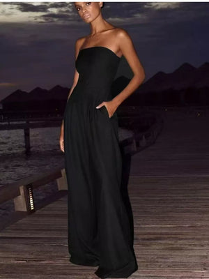 Black strapless wide-leg maternity romper with pockets, full length.