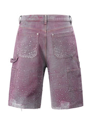 Fuchsia pink denim bermuda shorts with allover crystal embellishments and distressed hem.
