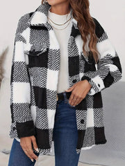 Oversized black and white checkerboard sherpa shacket with button-down front and chest pockets.