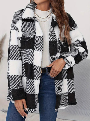 Oversized black and white checkerboard sherpa shacket with button-down front and chest pockets.