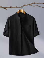 Black short sleeve button up shirt with mandarin collar and chest pocket