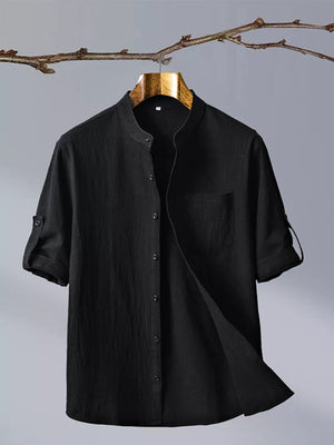 Black short sleeve button up shirt with mandarin collar and chest pocket
