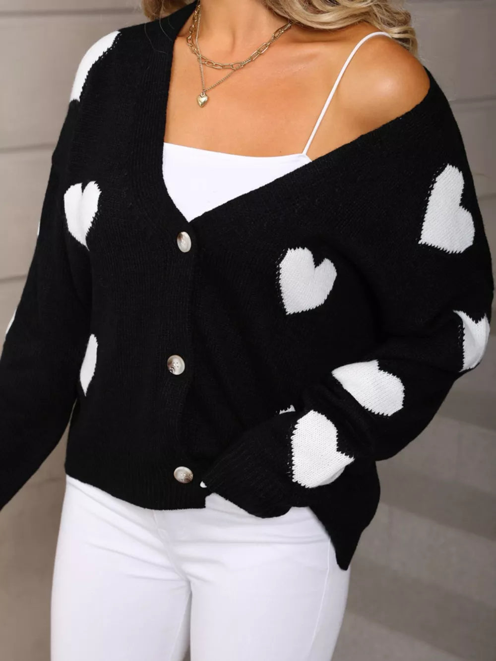 Black knit cardigan with white heart pattern, button front, V-neck, acrylic