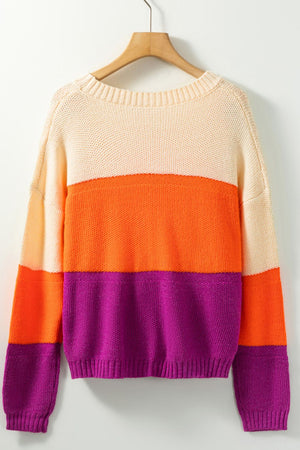 Colorblock ribbed knit pullover sweater with crew neck and long sleeves in cream, orange, and purple stripes.