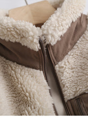 Sherpa zip-up jacket in beige with brown trim and zipper detail.
