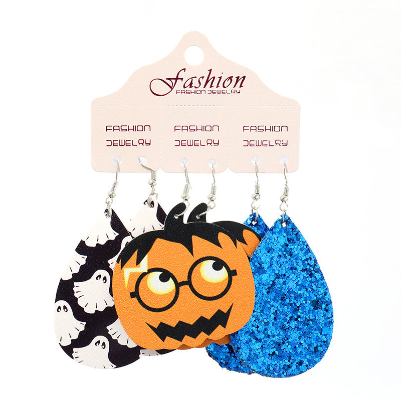 Spooky Halloween dangle earrings set with ghost pattern, jack-o-lantern, and blue glitter teardrop designs.