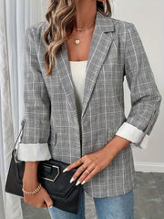 Light gray plaid blazer with buttoned front and cuffed sleeves.