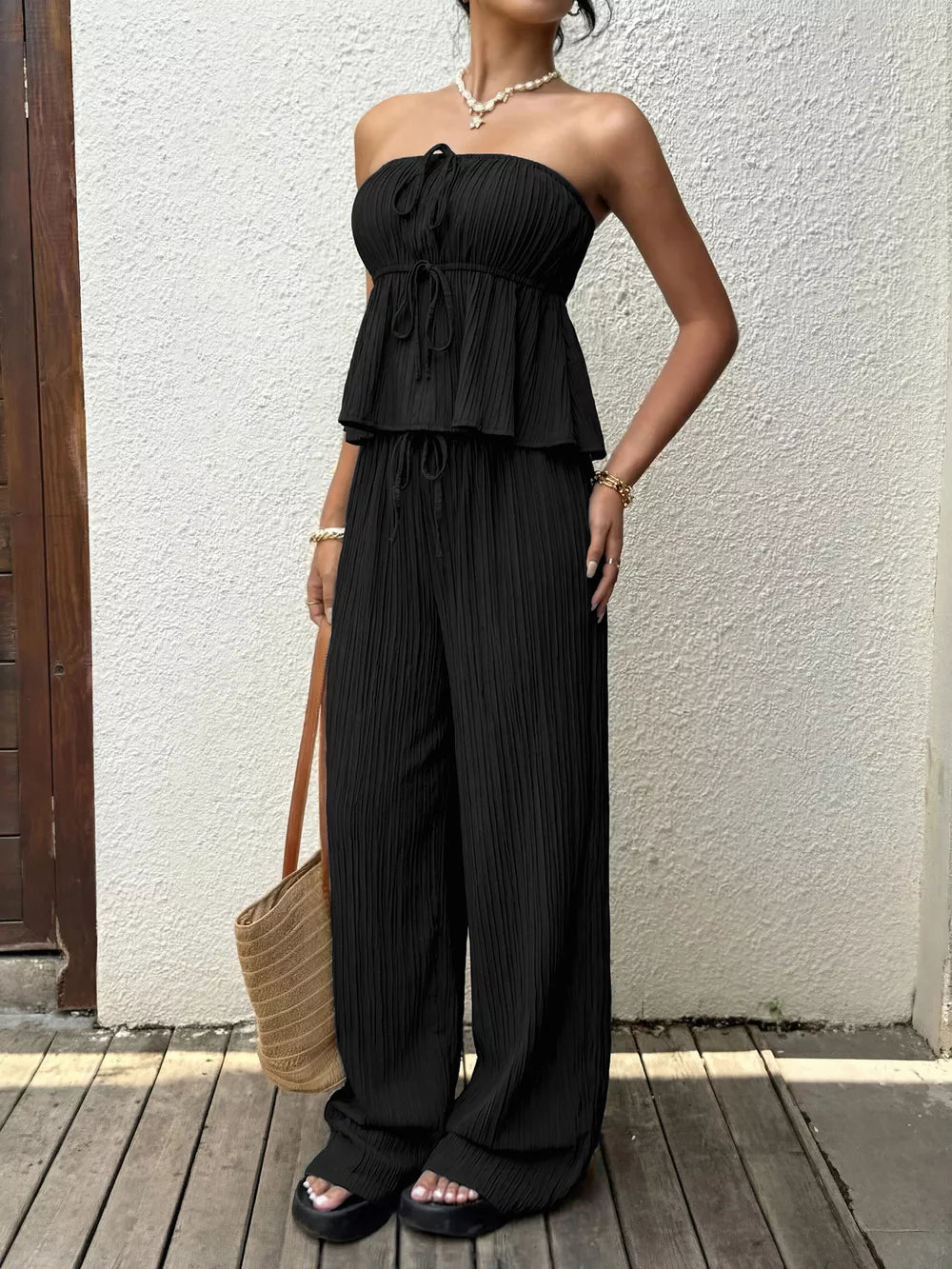 Black pleated tube top outfit set with wide-leg pants and tie detail