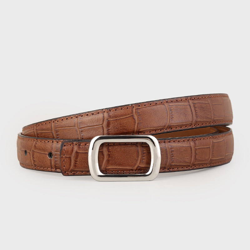 Brown crocodile textured cowhide leather belt with a silver buckle.