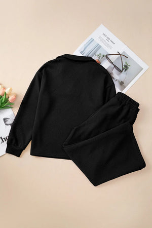 Black quilted knit collared loungewear set with textured pattern and long sleeves.