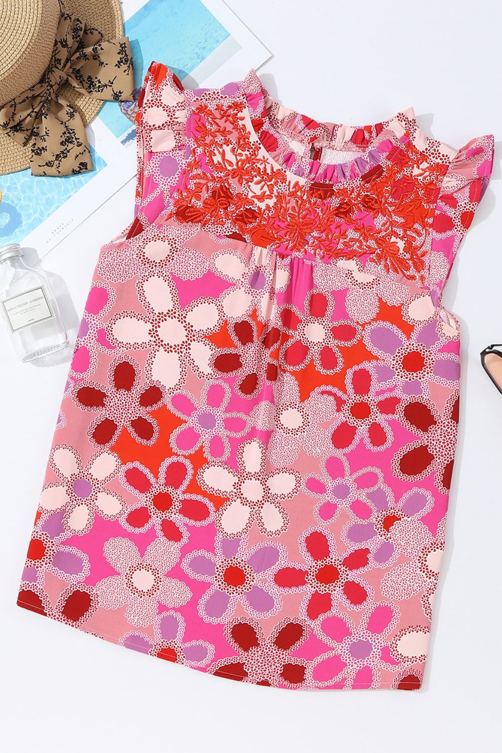 Floral embroidered yoke ruffle sleeve top in strawberry pink with a bold floral print.