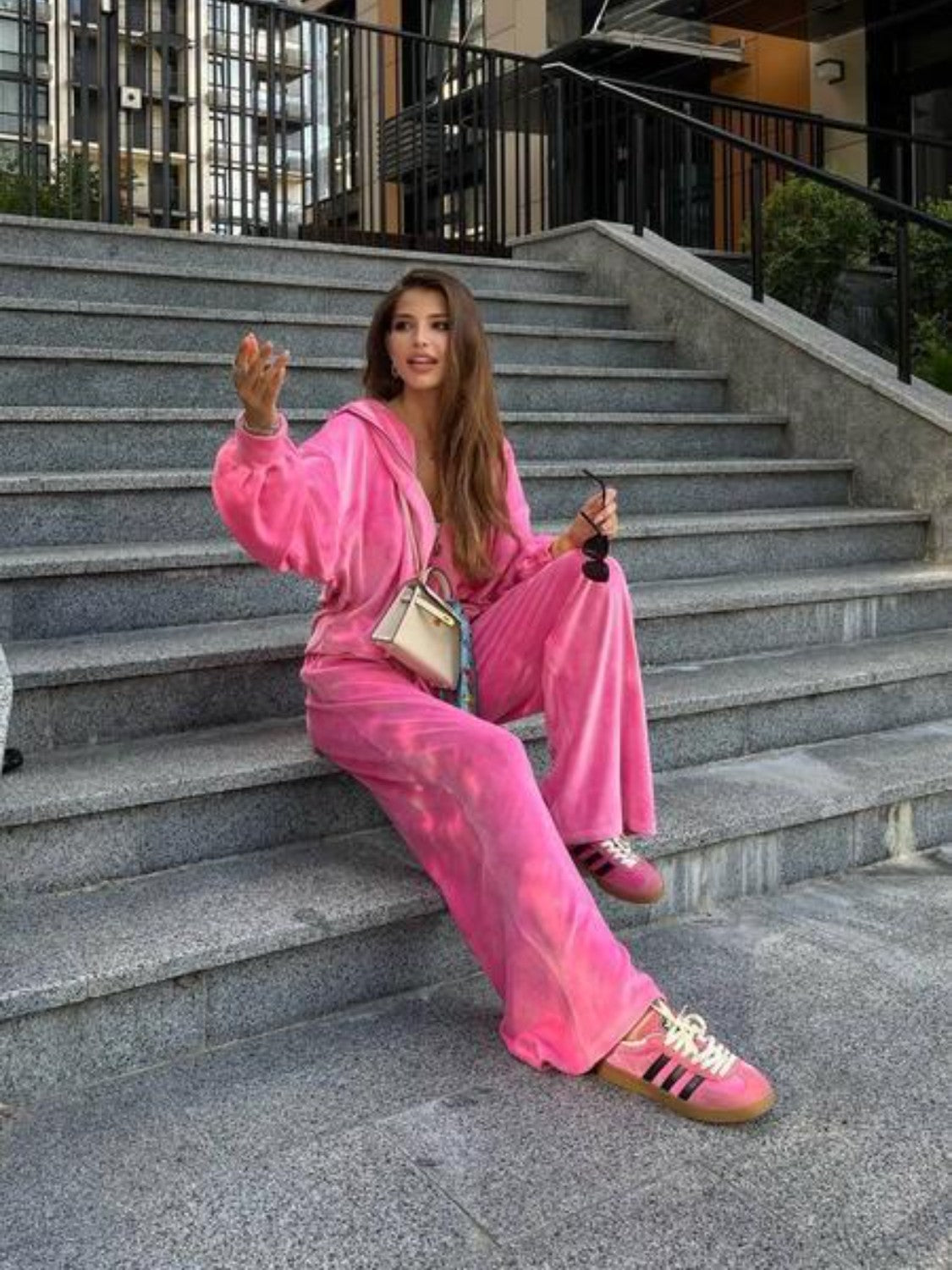Plush velour lounge set in hot pink with wide leg pants and a zip-up hoodie.