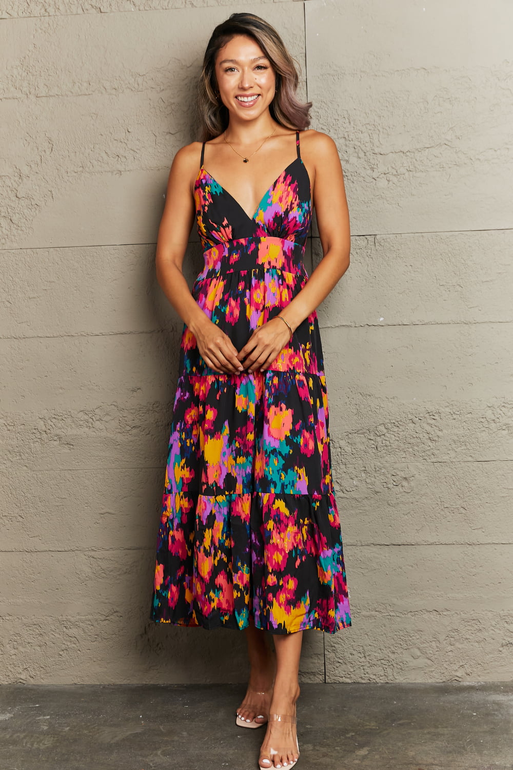 Abstract brushstroke midi dress with V-neck and tiered skirt in black with multicolor print.