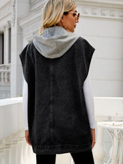 Sleeveless dark denim utility jacket with grey hood and contrast stitching.
