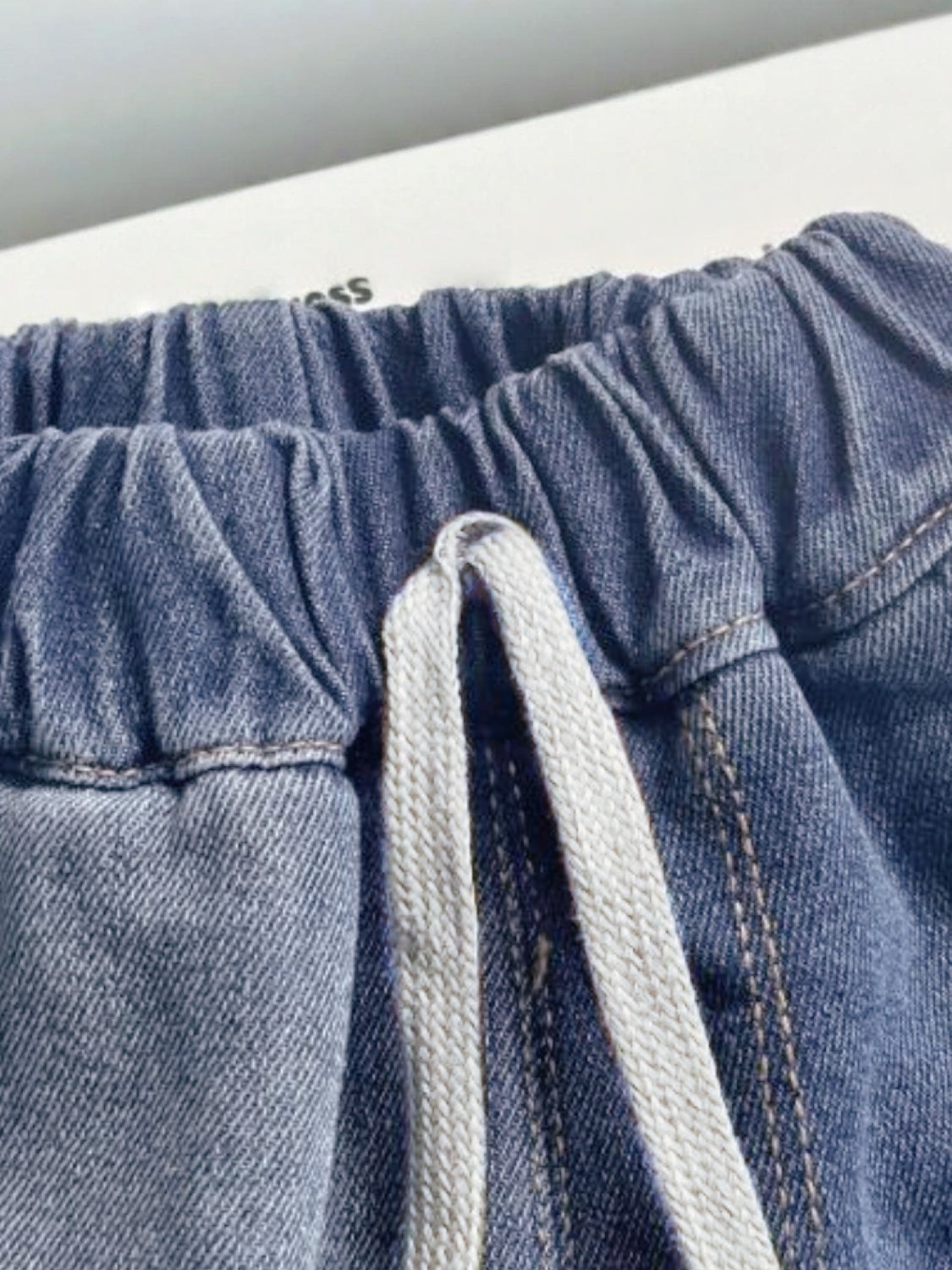 Relaxed denim shorts with elastic waistband and drawstring detail