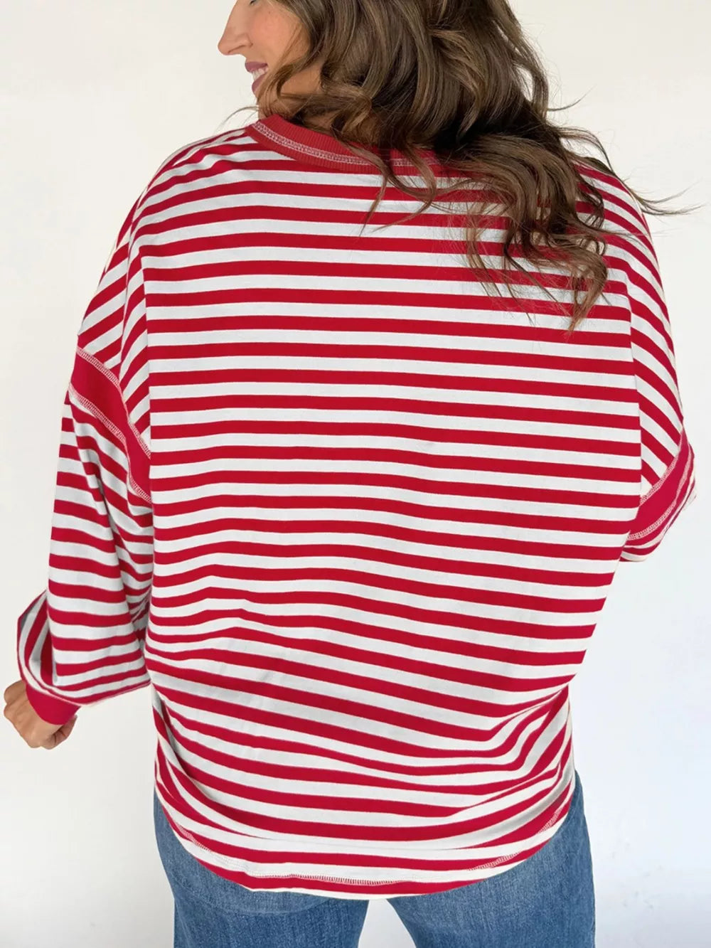Red and white striped cotton sweatshirt with a V-neck and long sleeves.