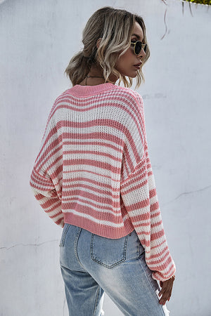 Cropped knit crew neck sweater with horizontal pink and white stripes.