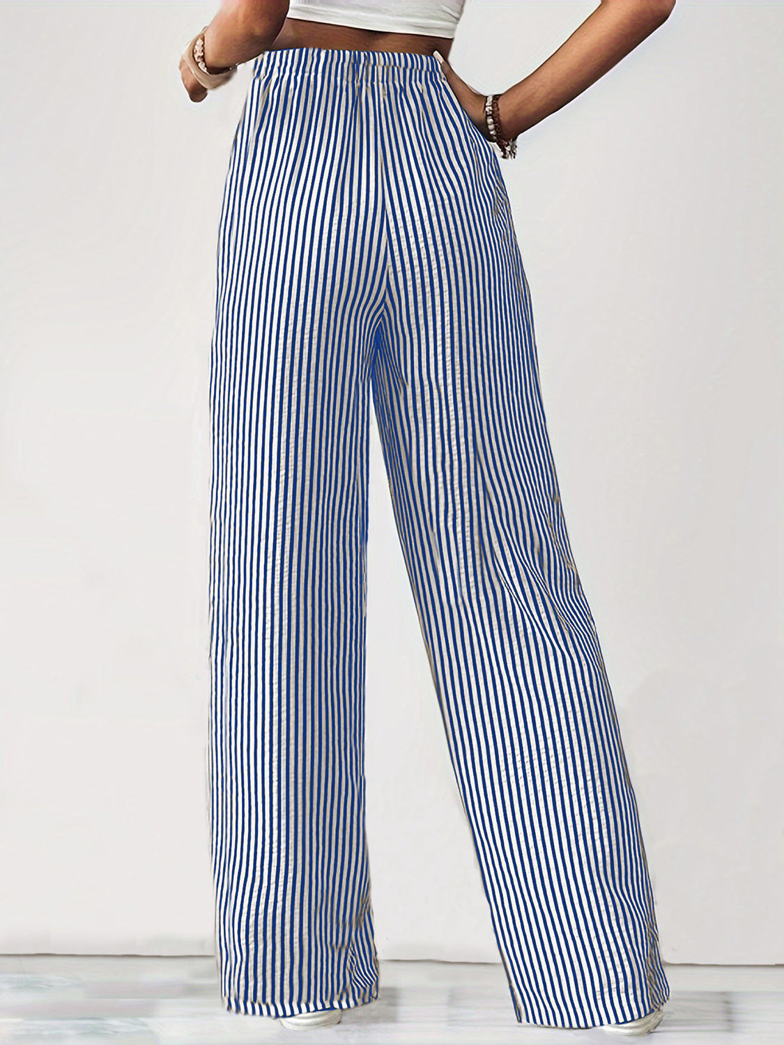 Blue and white striped wide-leg drawstring trousers with a relaxed fit.