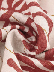 Charming Floral Tie-front Wide-leg Romper in cream with red floral print, showing fabric detail.