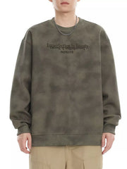 Oversized Army Green tie-dye sweatshirt with embroidered text detail.