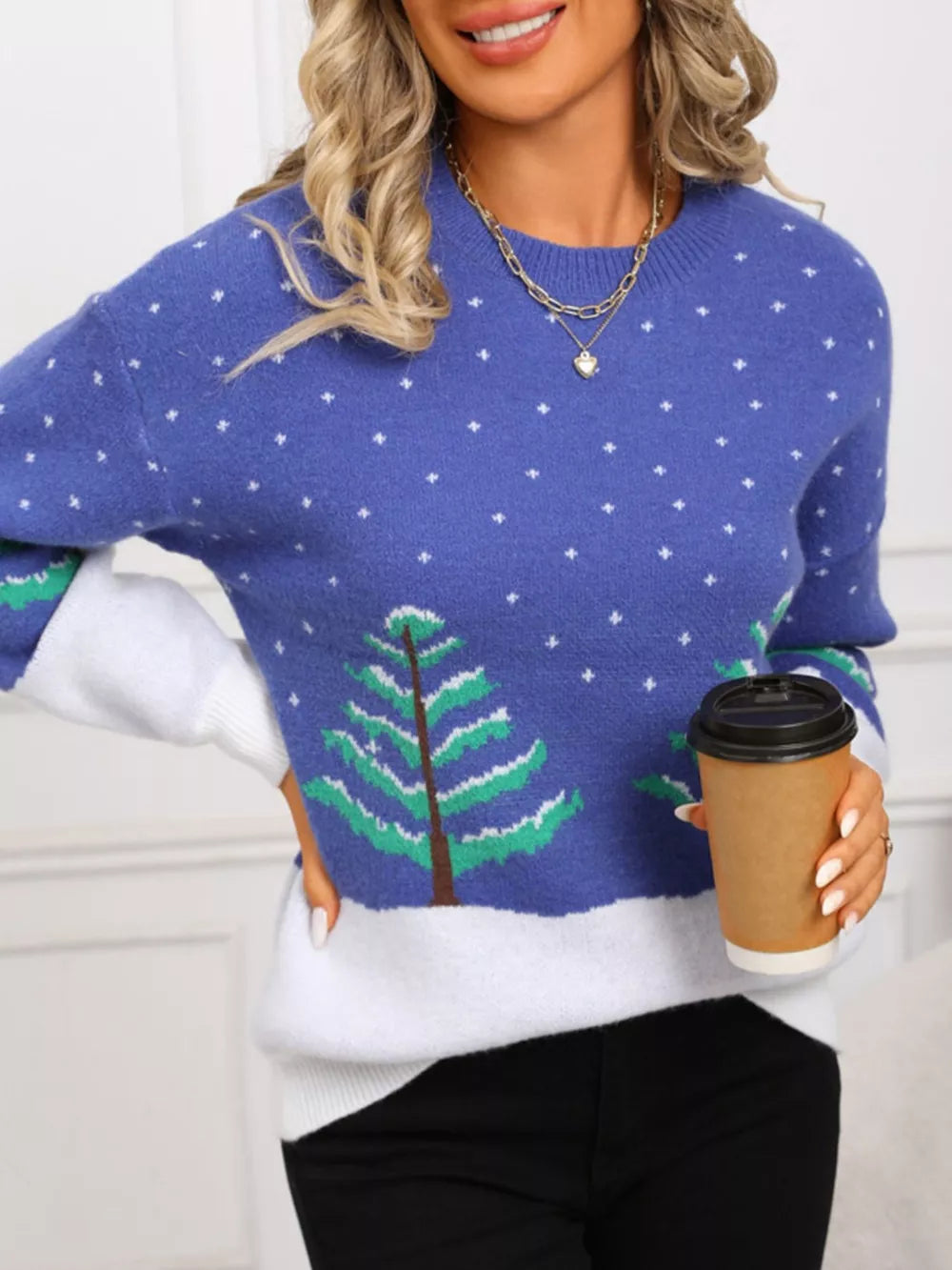 Blue acrylic sweater with white snow and green tree pattern, crew neck, long sleeves.