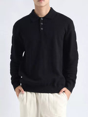Black knit polo top with button accents and long sleeves.