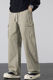 Khaki relaxed fit cargo sweatpants with drawstring and button flap pockets.