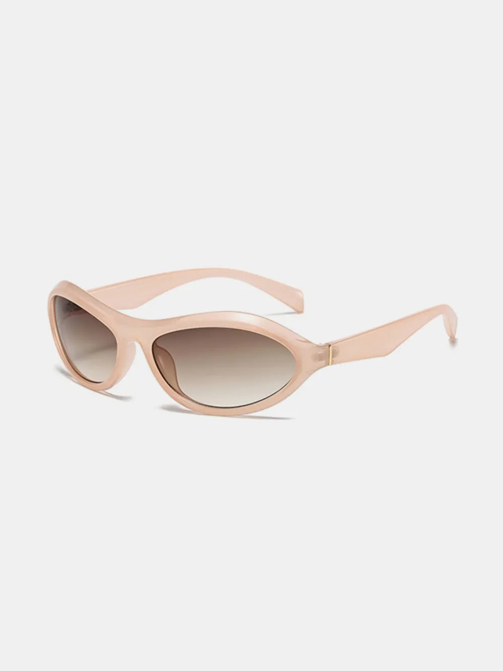 Blush pink sculpted oval lens sunglasses with gradient brown lenses.