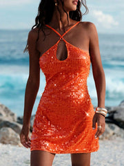 Orange sequin mini dress with halter neck and keyhole detail.