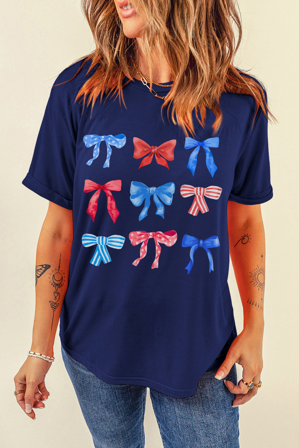Dark blue crewneck tee with watercolor bow print, short sleeves, and casual fit.