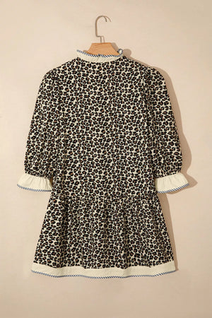 Leopard print mini dress with ruffled mock neck, tiered skirt, and striped trim cuffs and hem.