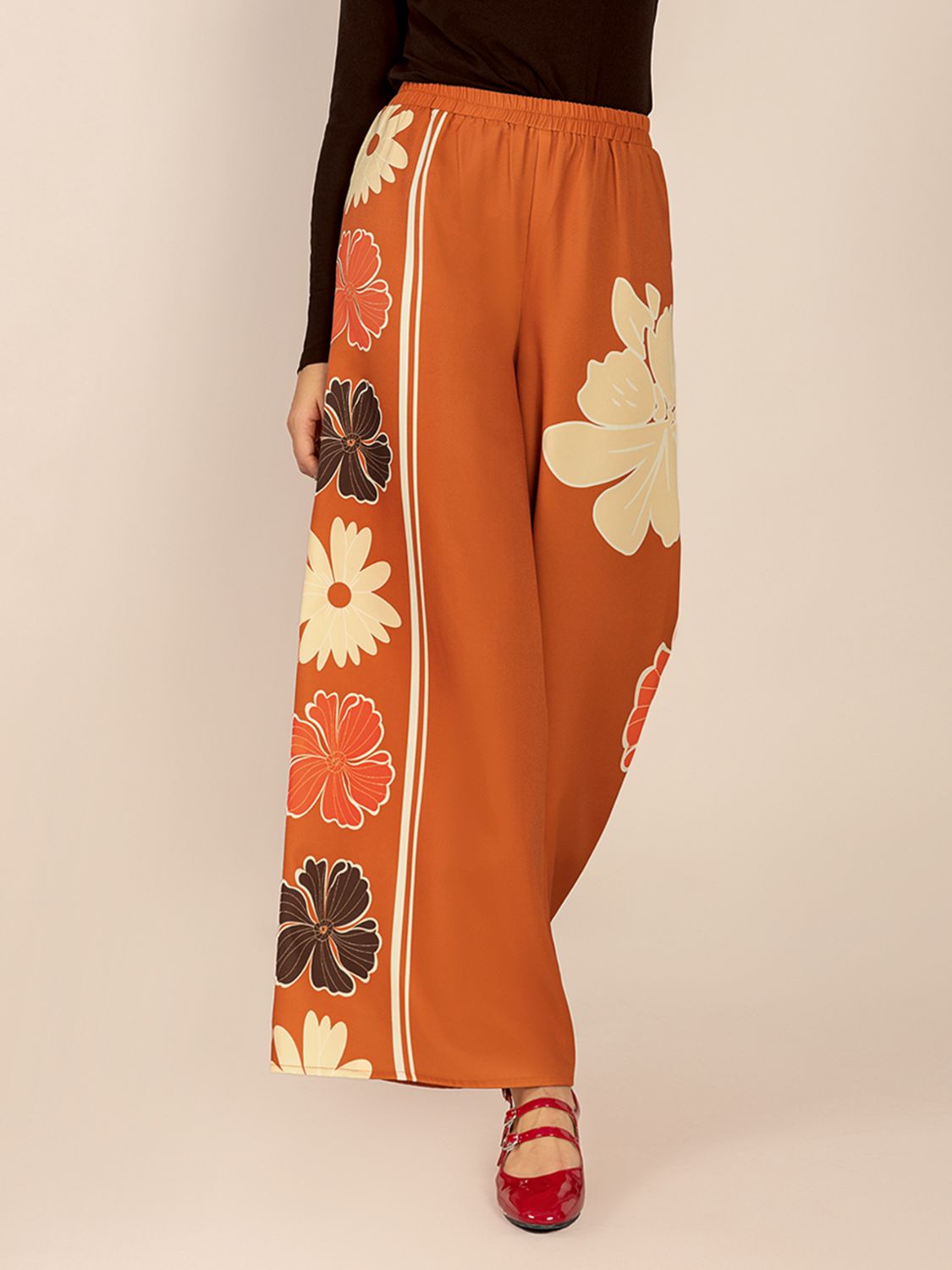 Tangerine Seventies floral palazzo trousers with side stripe detail.