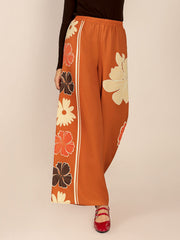 Tangerine Seventies floral palazzo trousers with side stripe detail.