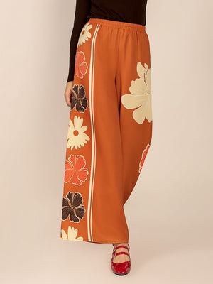Tangerine Seventies floral palazzo trousers with side stripe detail.