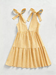 Yellow gingham mini dress with tie straps and tiered skirt