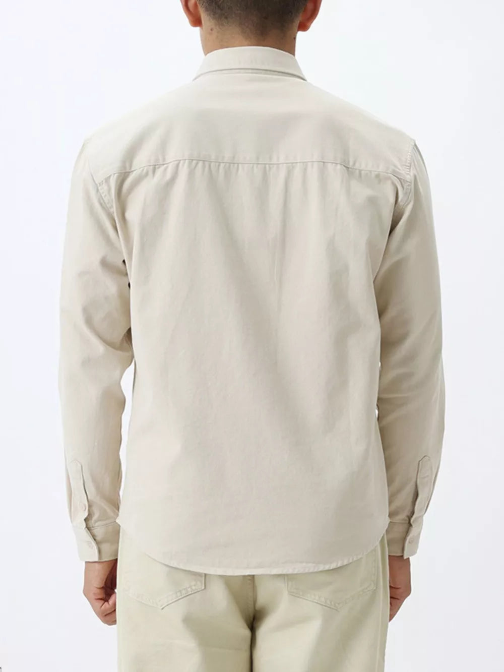 Apricot cotton buttoned long sleeve undershirt with back yoke detail.