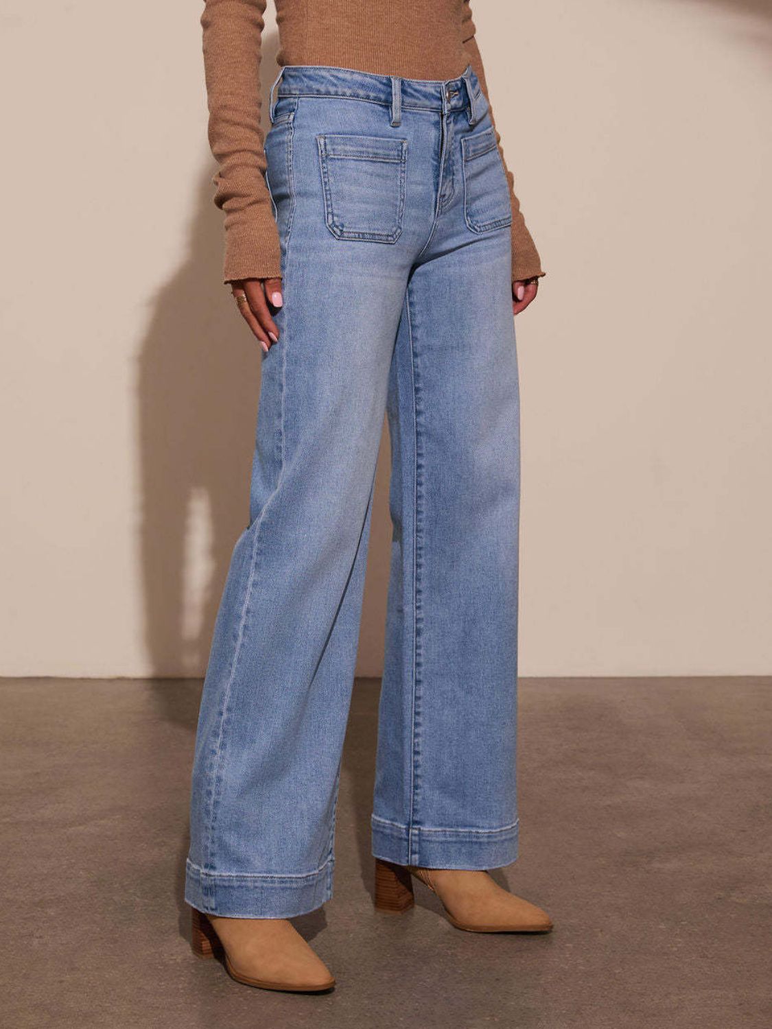 Sailor-inspired light wash wide leg denim jeans with utility pockets and a cuffed hem.