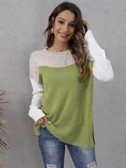 Colorblock crewneck knit sweater in lime green, beige, and white with side slits.