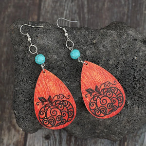 Autumnal pumpkin wood dangle earrings with turquoise beads and silver hooks.